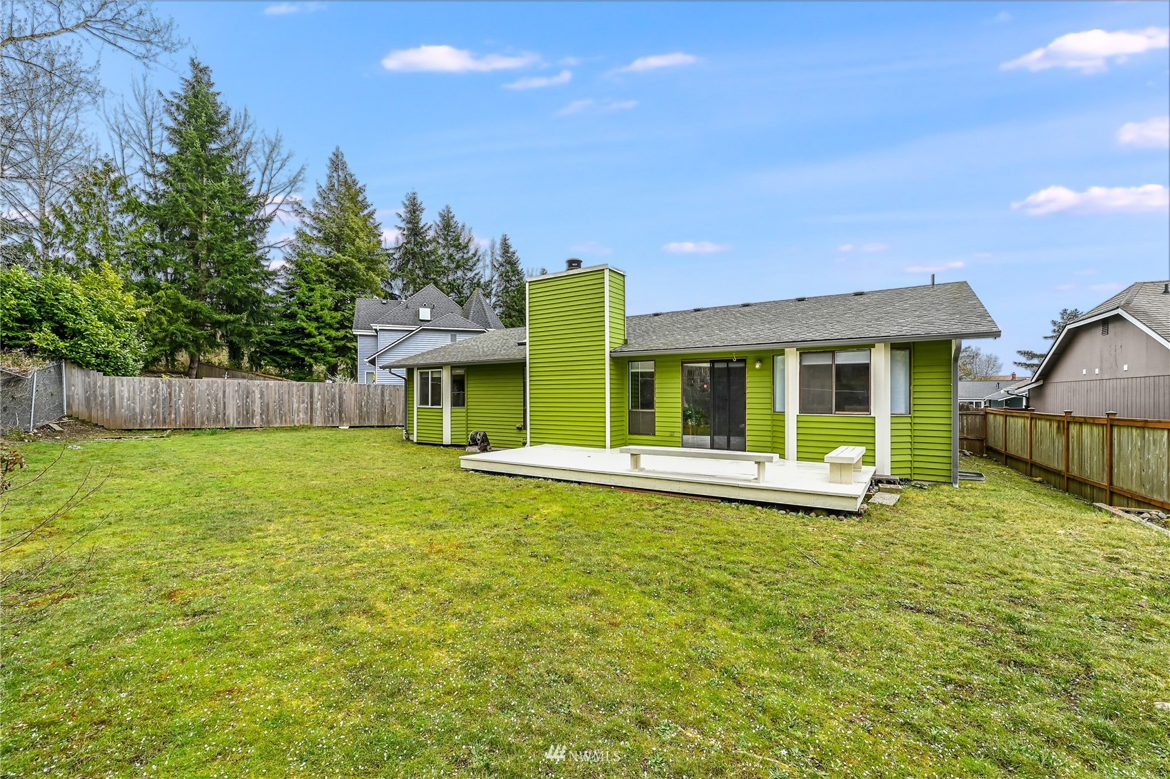 1217 225th Place Southwest Bothell, WA 98021 - Photo 20 of 21 a view of an house with backyard space and balcony