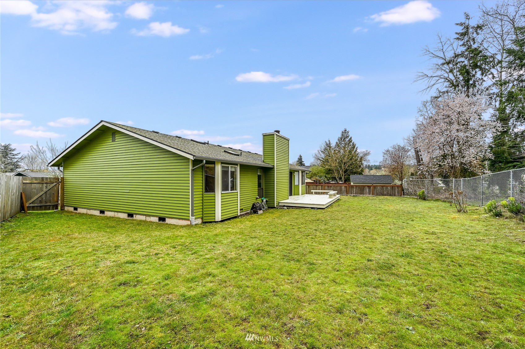 1217 225th Place Southwest Bothell, WA 98021 - Photo 21 of 21 a view of a house with a backyard