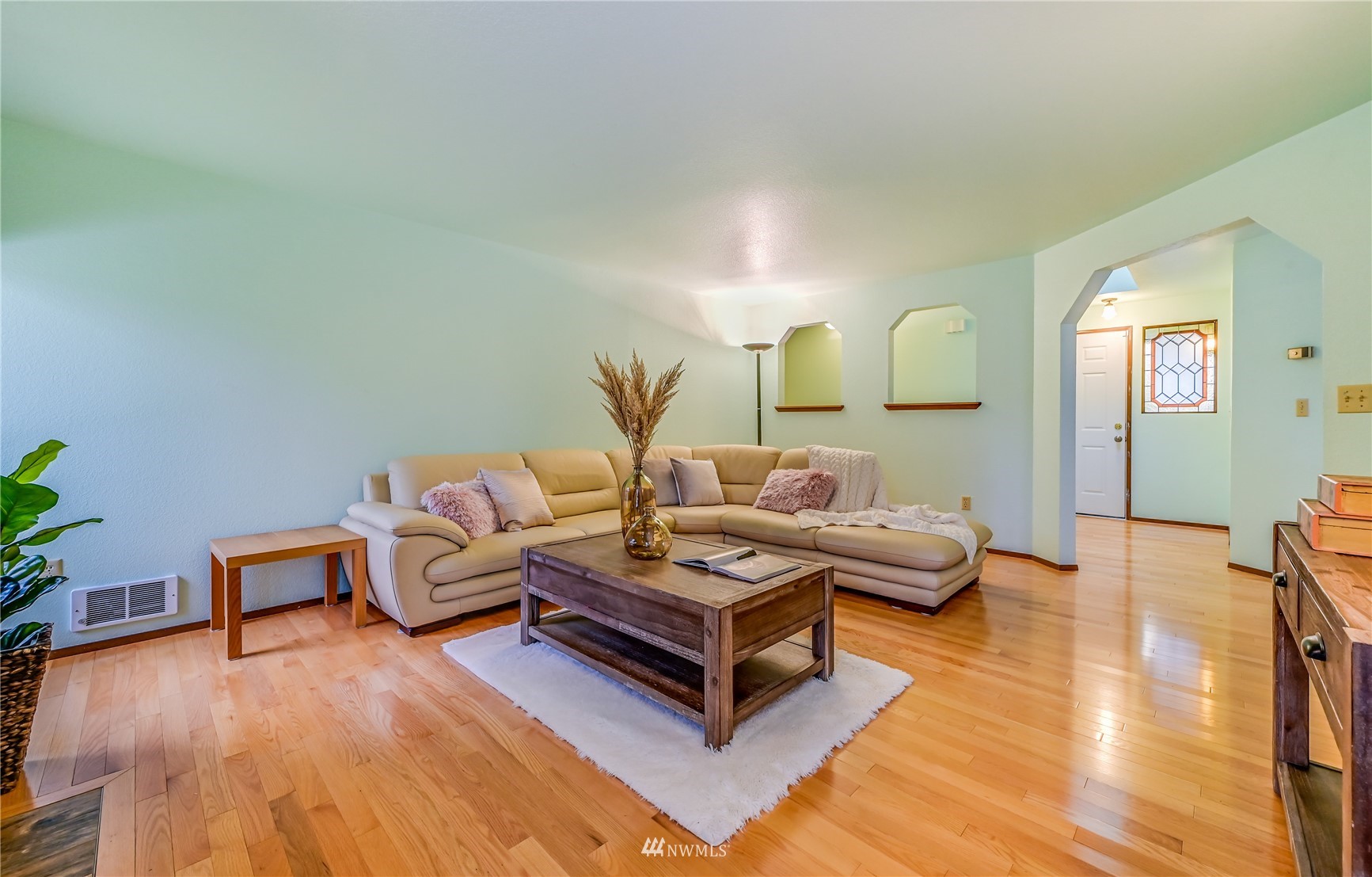 1217 225th Place Southwest Bothell, WA 98021 - Photo 6 of 21 a living room with furniture and wooden floor