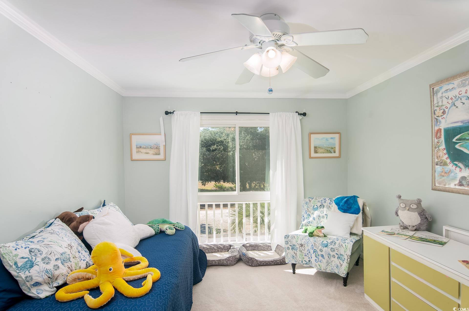 27 Pheasant Loop, Unit 293 Georgetown, SC 29440 - Photo 17 of 23 Bedroom featuring ornamental molding, light carpet, and ceiling fan