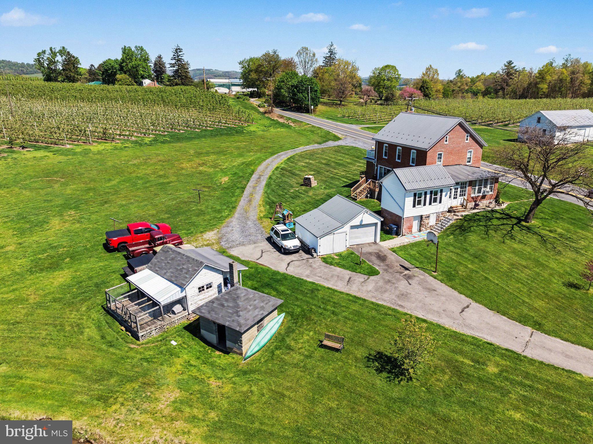 420 Carlisle Road Biglerville, PA 17307 - Photo 36 of 41 an aerial view of a house with a garden and swimming pool