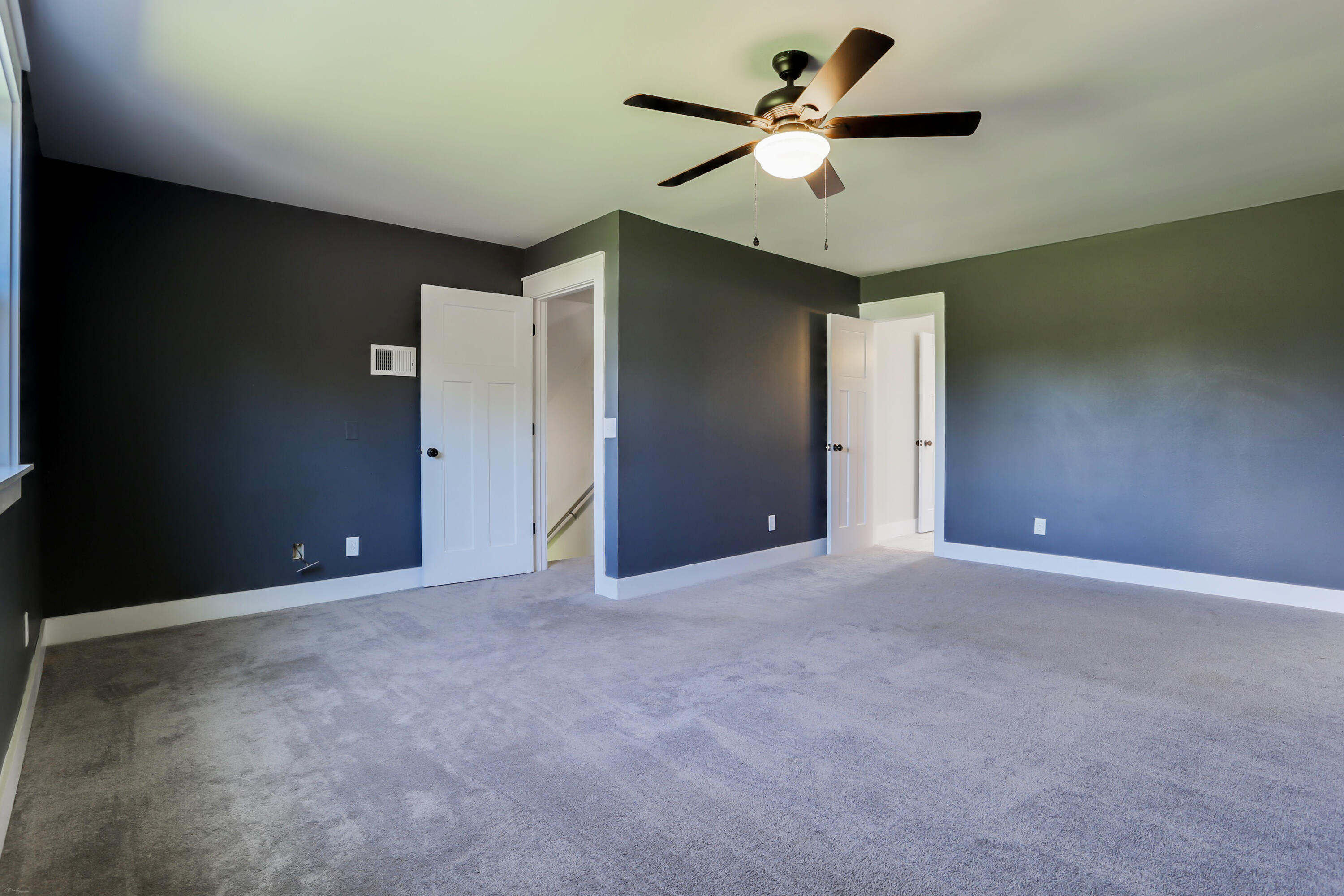 5916 Jack Stokes Road Baker, FL 32531 - Photo 54 of 76 a view of a big room with a ceiling fan and a chandelier fan