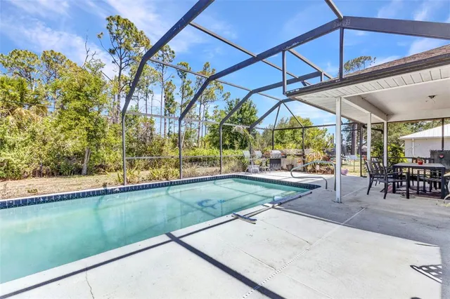 a view of yard with patio