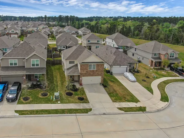an aerial view of residential houses with outdoor space
