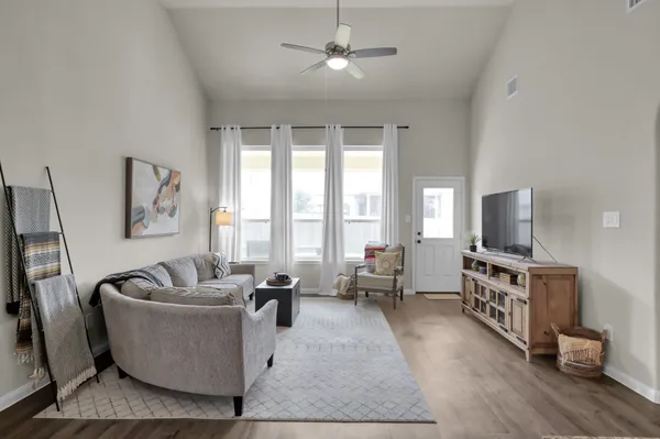 a living room with furniture and a flat screen tv
