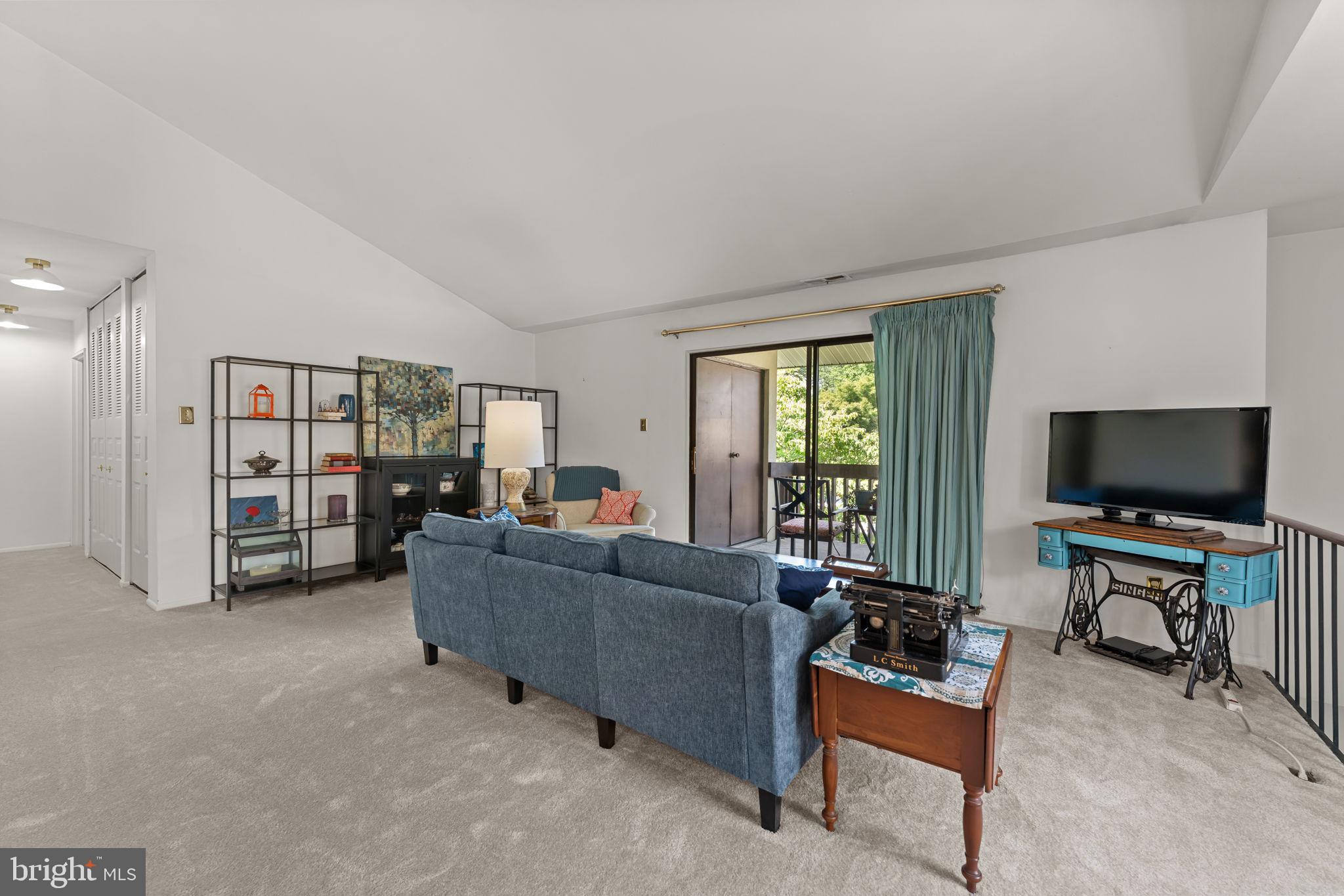 108 Raintree Lane, Unit 108 Malvern, PA 19355 - Photo 4 of 27 Spacious living room with vaulted ceiling!