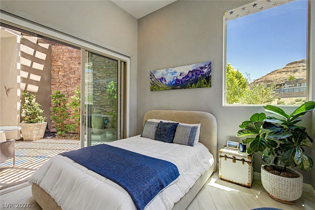 6014 Willow Ridge Court Las Vegas, NV 89135 - Photo 53 of 99 This bright room features a seamless indoor-outdoor connection with a private patio and captivating mountain views.