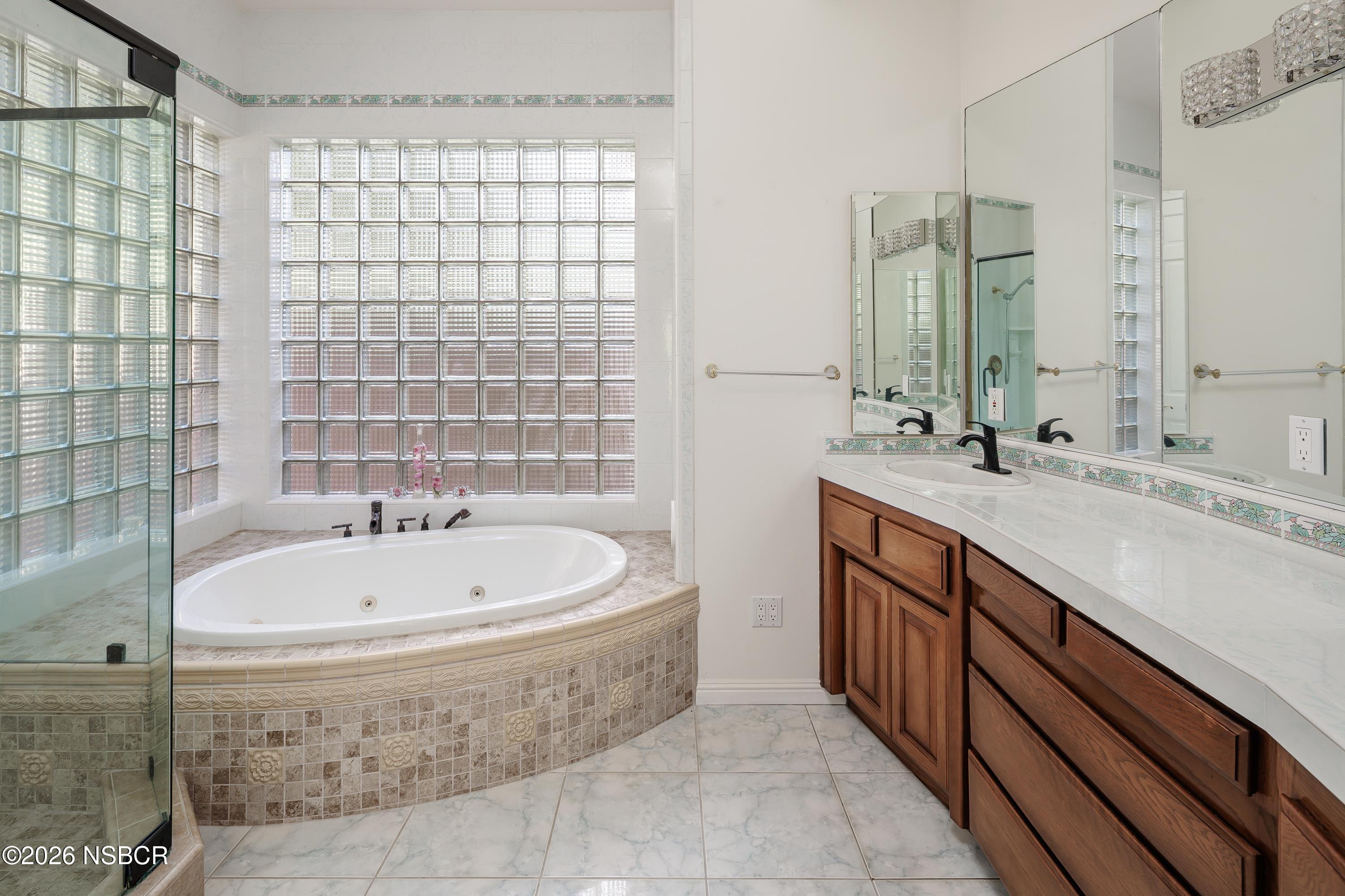 2655 Adobe Falls Road Lompoc, CA 93436 - Photo 27 of 51 a spacious bathroom with a bathtub and a sink