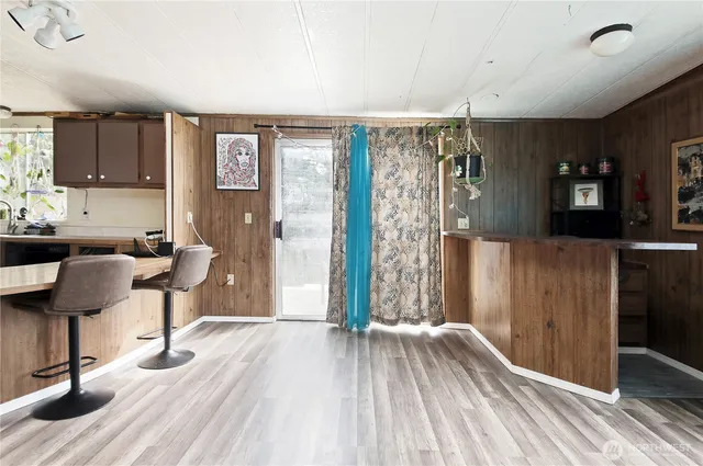 a view of a livingroom with furniture and a window