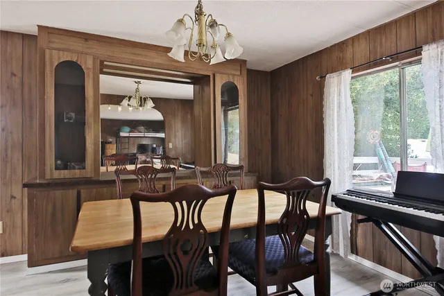 a view of a dining room with furniture window and outside view