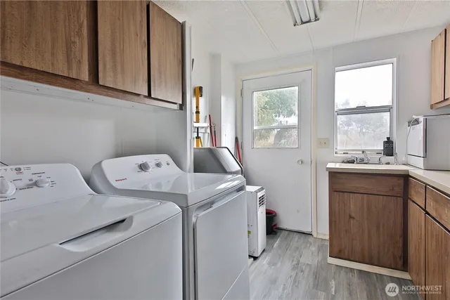 a utility room with closet dryer and washer