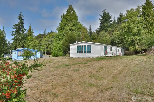 a house with trees in the background