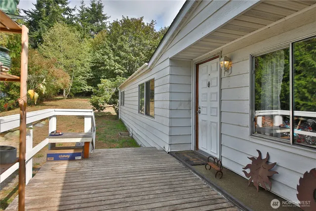 a view of a deck with wooden floor and seating space