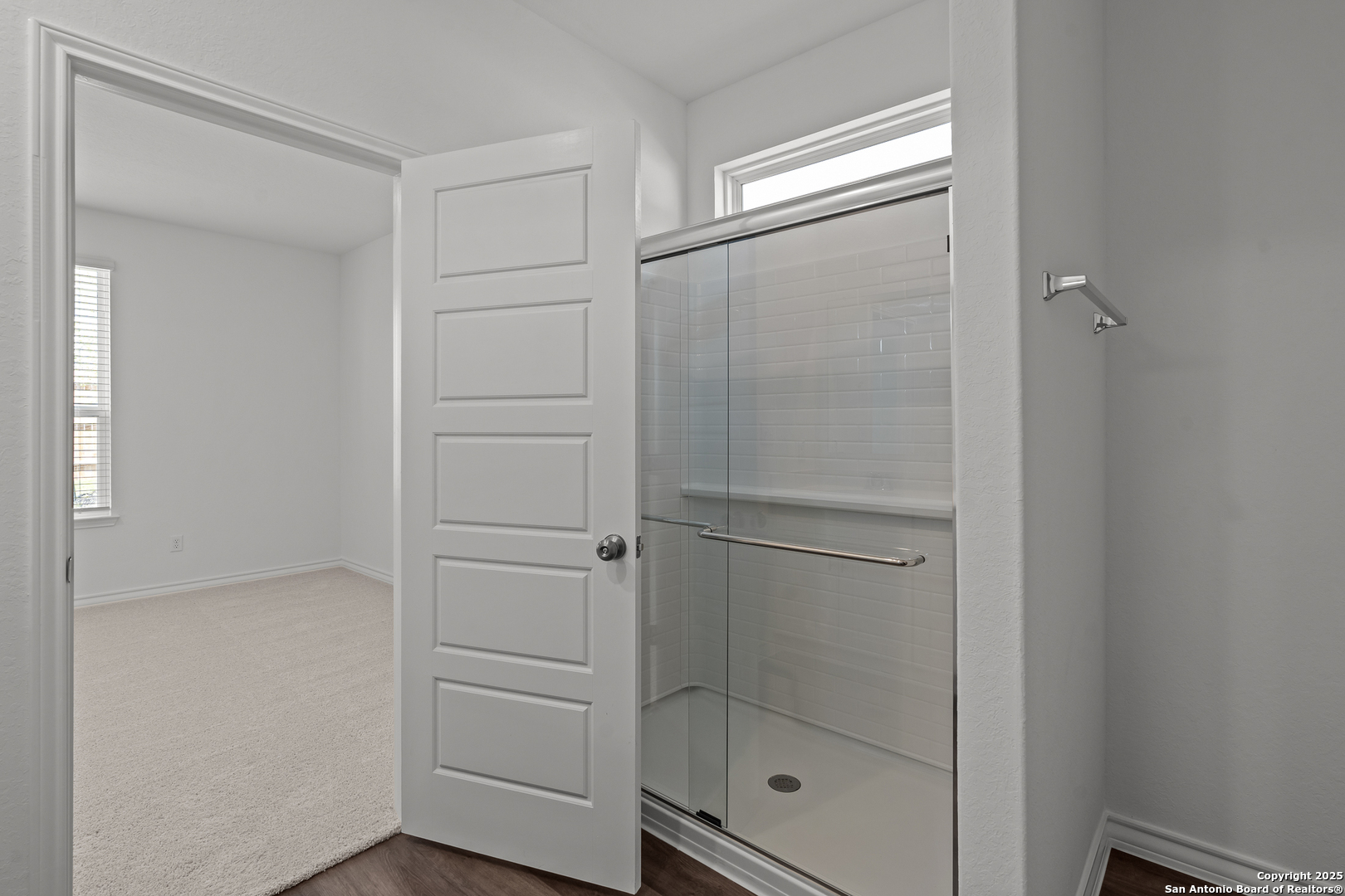 4141 Bermuda Lane Seguin, TX 78155 - Photo 17 of 28 a bathroom with a glass shower door