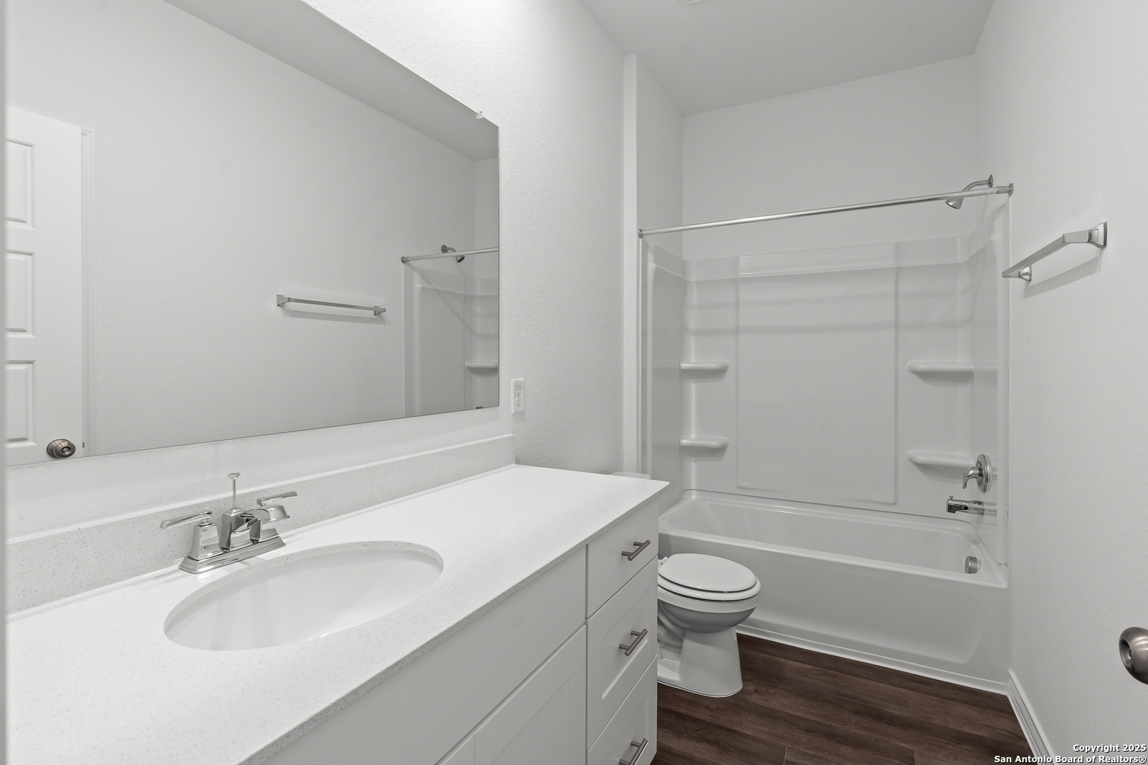 4141 Bermuda Lane Seguin, TX 78155 - Photo 21 of 28 a bathroom with a granite countertop toilet a sink and a bathtub