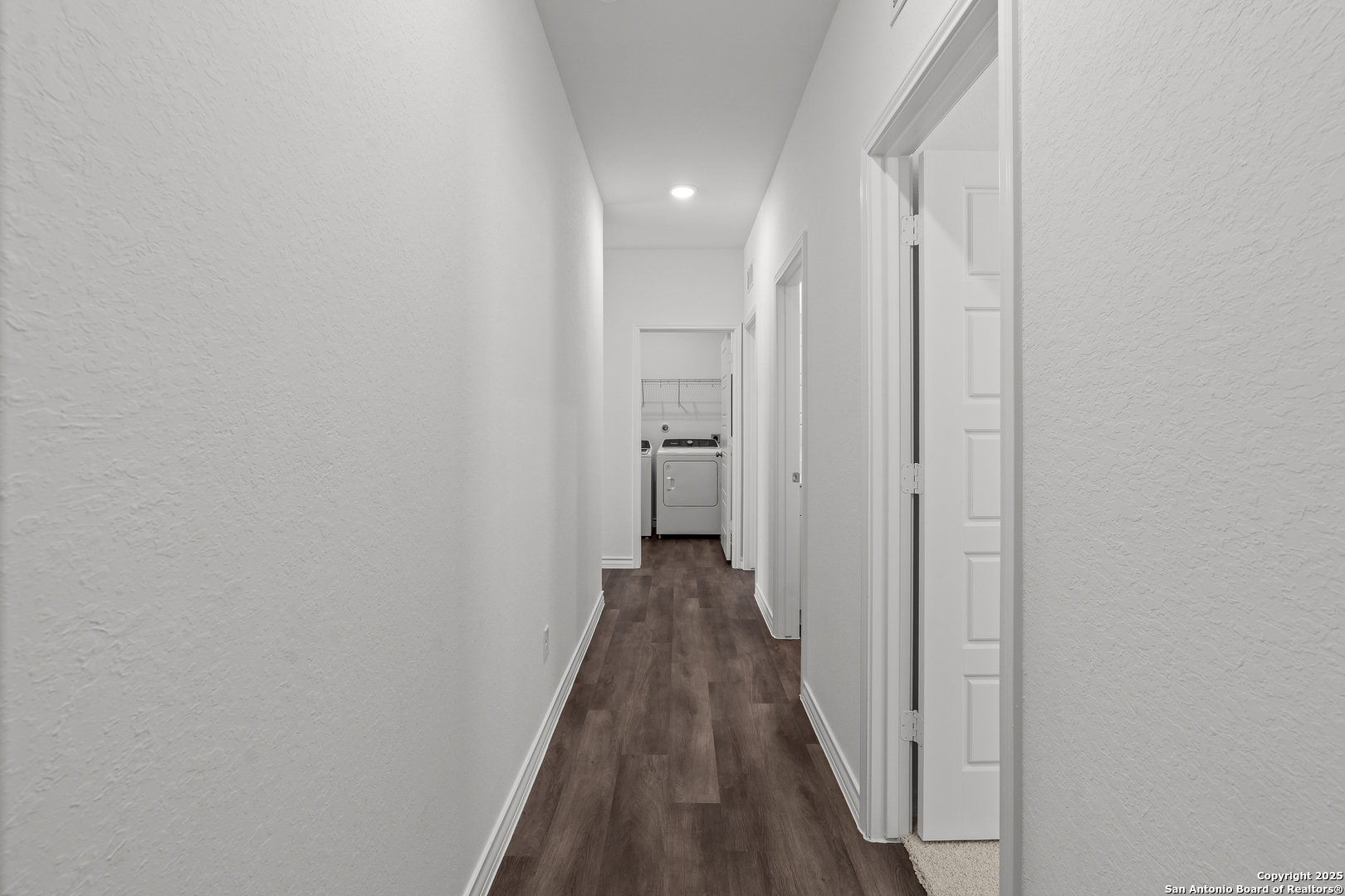 4141 Bermuda Lane Seguin, TX 78155 - Photo 25 of 28 a view of a hallway with wooden floor and a bathroom