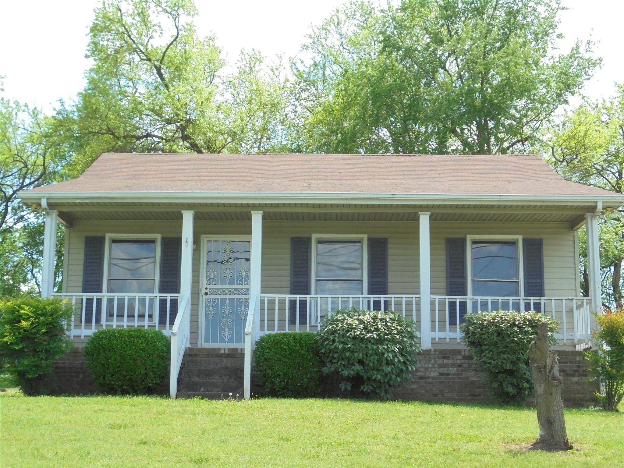 a view of a house with a garden