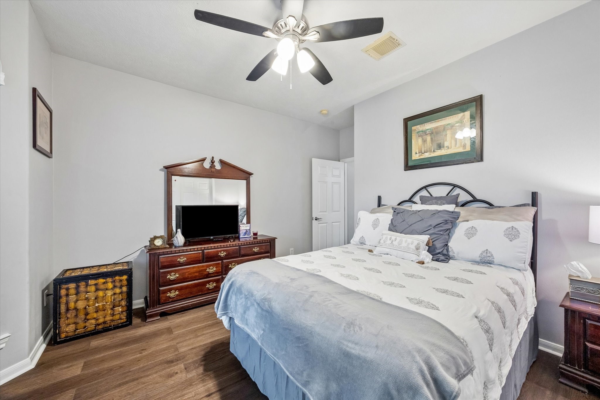 12423 Rutgers Park Court Houston, TX 77058 - Photo 19 of 29 a bedroom with a bed and a flat screen tv