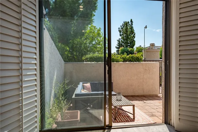 a outdoor living space with furniture and a potted plant