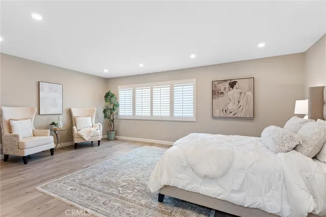 a bedroom with a bed and a lamp