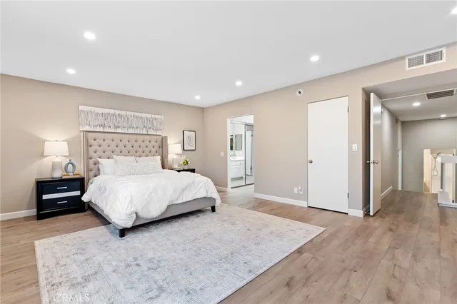 a spacious bathroom with a double vanity sink mirror and shower