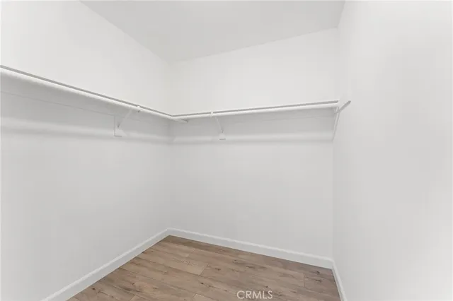 a bathroom with a shower sink vanity and mirror