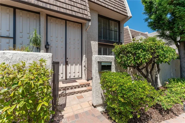 a view of swimming pool with outdoor seating and plants