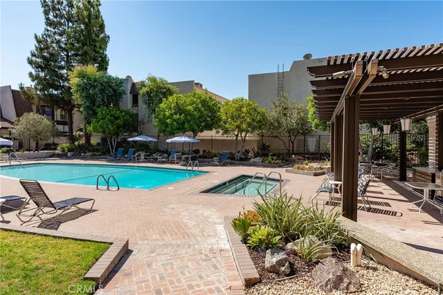 a view of a swimming pool with a patio