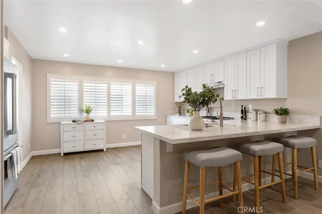 a kitchen with furniture and window