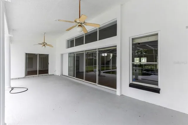 a view of a big room with windows