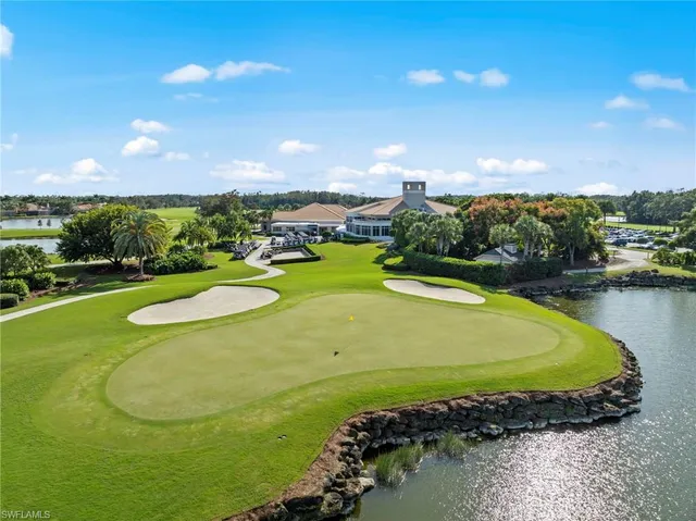 a view of a swimming pool a yard and outdoor seating