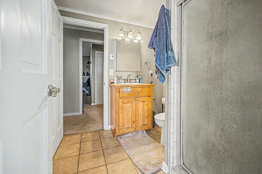 2014 East 9th Street Craig, CO 81625 - Photo 14 of 29 a bathroom with a sink toilet and shower