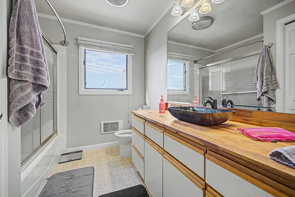 2014 East 9th Street Craig, CO 81625 - Photo 17 of 29 a bathroom with a sink and a mirror