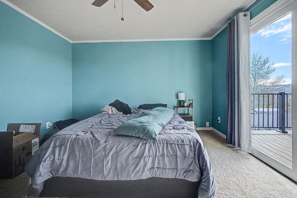 2014 East 9th Street Craig, CO 81625 - Photo 19 of 29 a bedroom with a bed and wooden floor