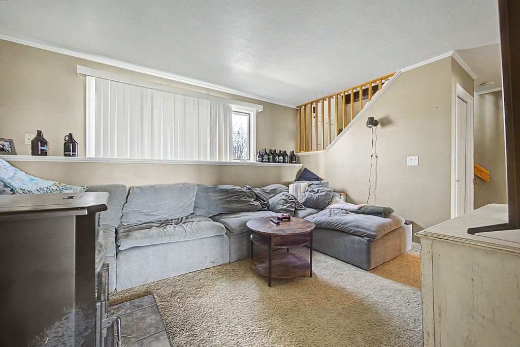 2014 East 9th Street Craig, CO 81625 - Photo 20 of 29 a living room with furniture and a window