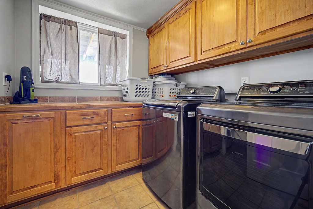 2014 East 9th Street Craig, CO 81625 - Photo 22 of 29 a kitchen with stainless steel appliances granite countertop a sink stove and cabinets