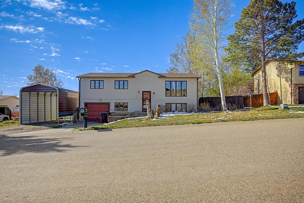 2014 East 9th Street Craig, CO 81625 - Photo 27 of 29 a view of house with outdoor space and tree s