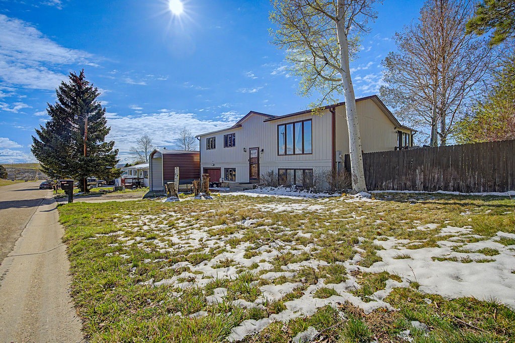 2014 East 9th Street Craig, CO 81625 - Photo 28 of 29 a view of a house with a yard