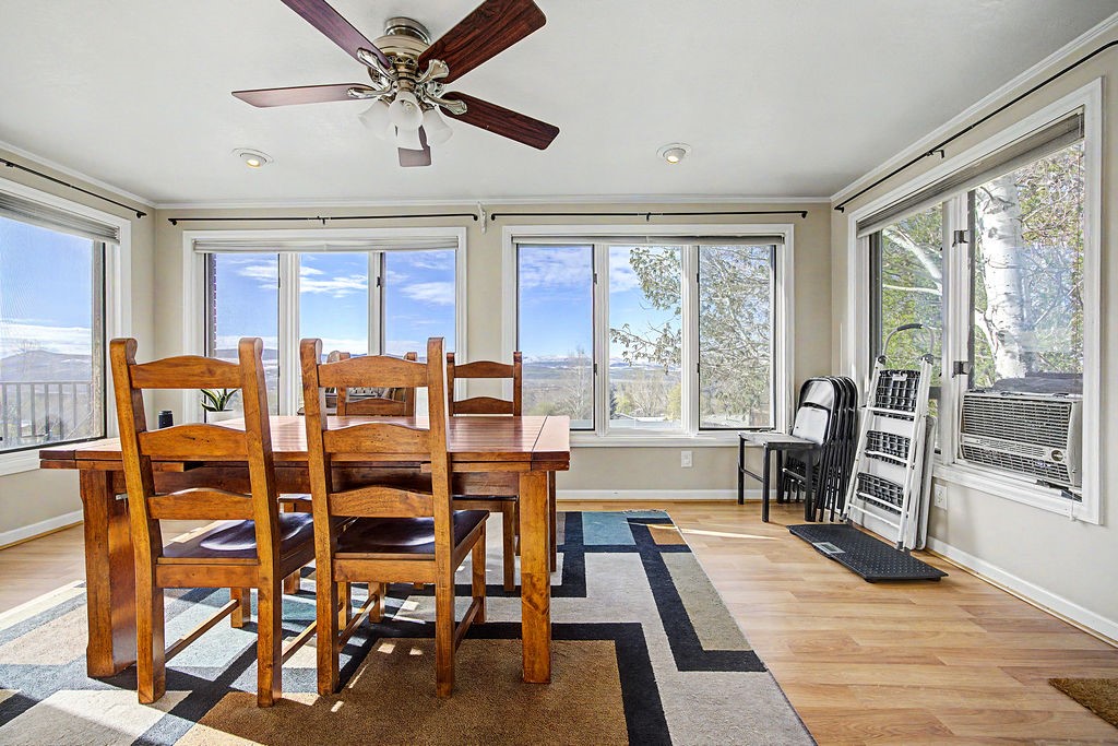 2014 East 9th Street Craig, CO 81625 - Photo 7 of 29 a dining room with furniture a chandelier and wooden floor