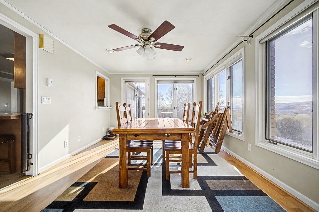 2014 East 9th Street Craig, CO 81625 - Photo 8 of 29 a view of a dining room with furniture window and wooden floor