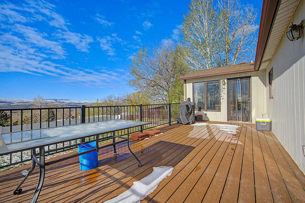 2014 East 9th Street Craig, CO 81625 - Photo 9 of 29 a balcony with wooden floor and outdoor space