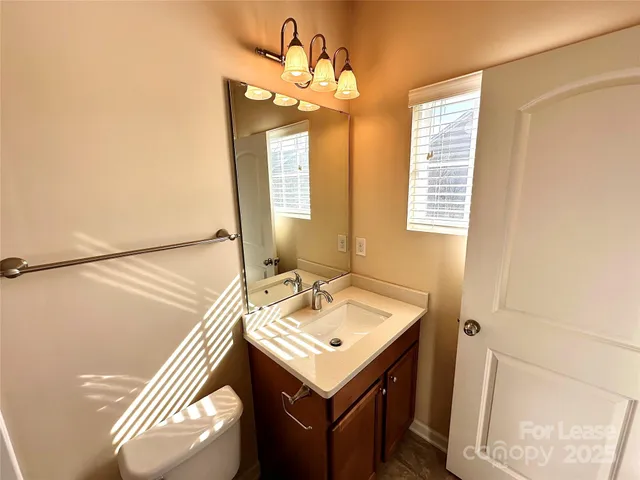 a bathroom with a sink a mirror and a shower