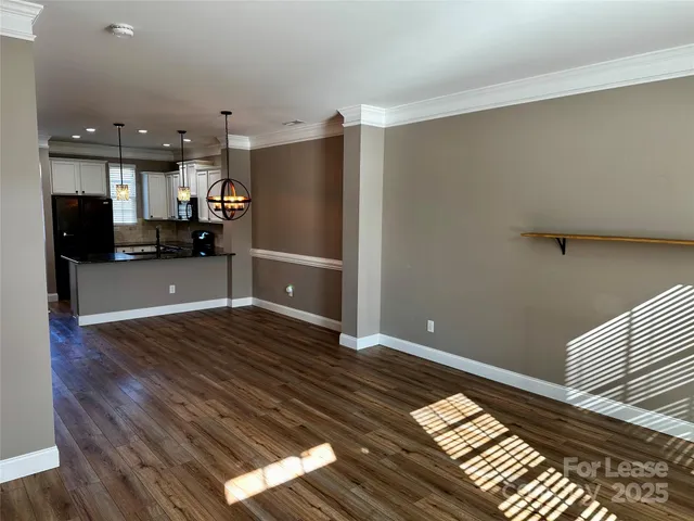 a kitchen with stainless steel appliances a refrigerator and a counter top space