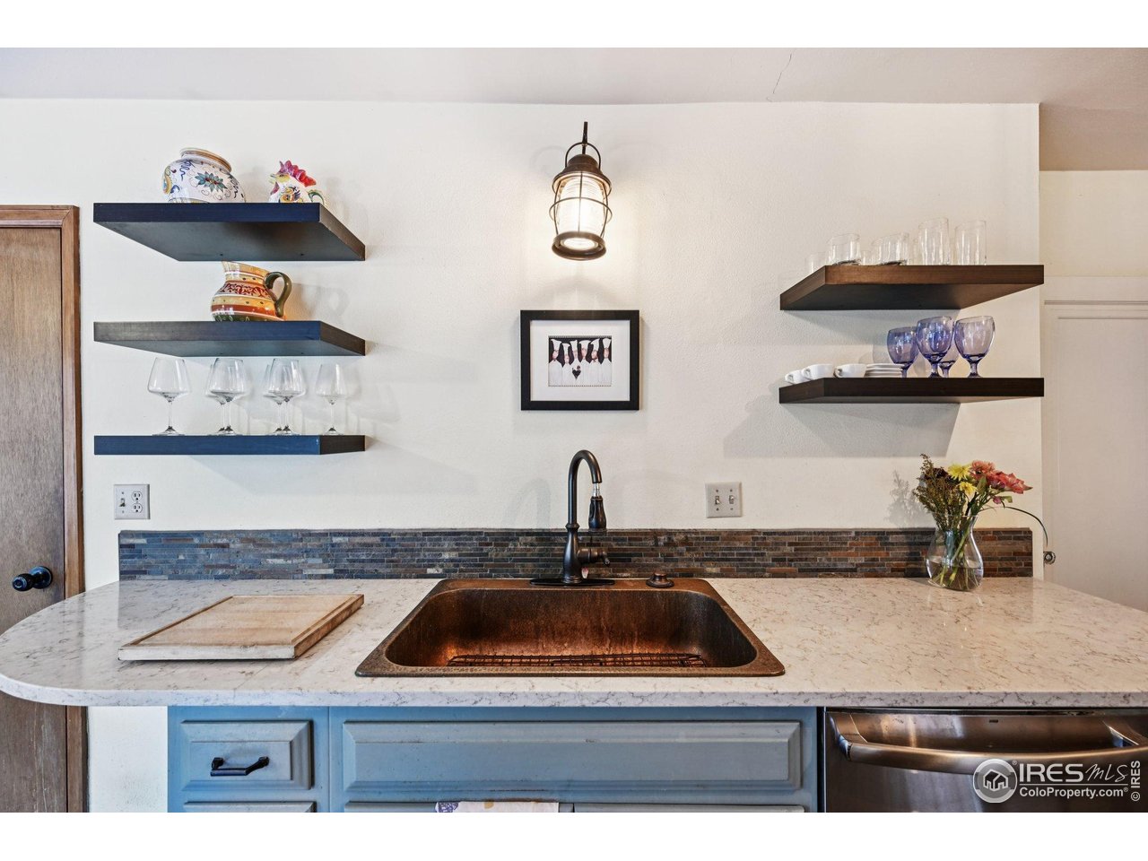 715 14th Street Boulder, CO 80302 - Photo 15 of 43 a kitchen with a sink and cabinets