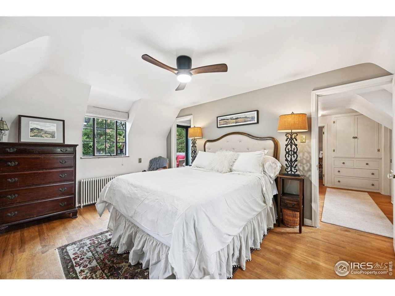 715 14th Street Boulder, CO 80302 - Photo 21 of 43 a bedroom with a bed and a dresser