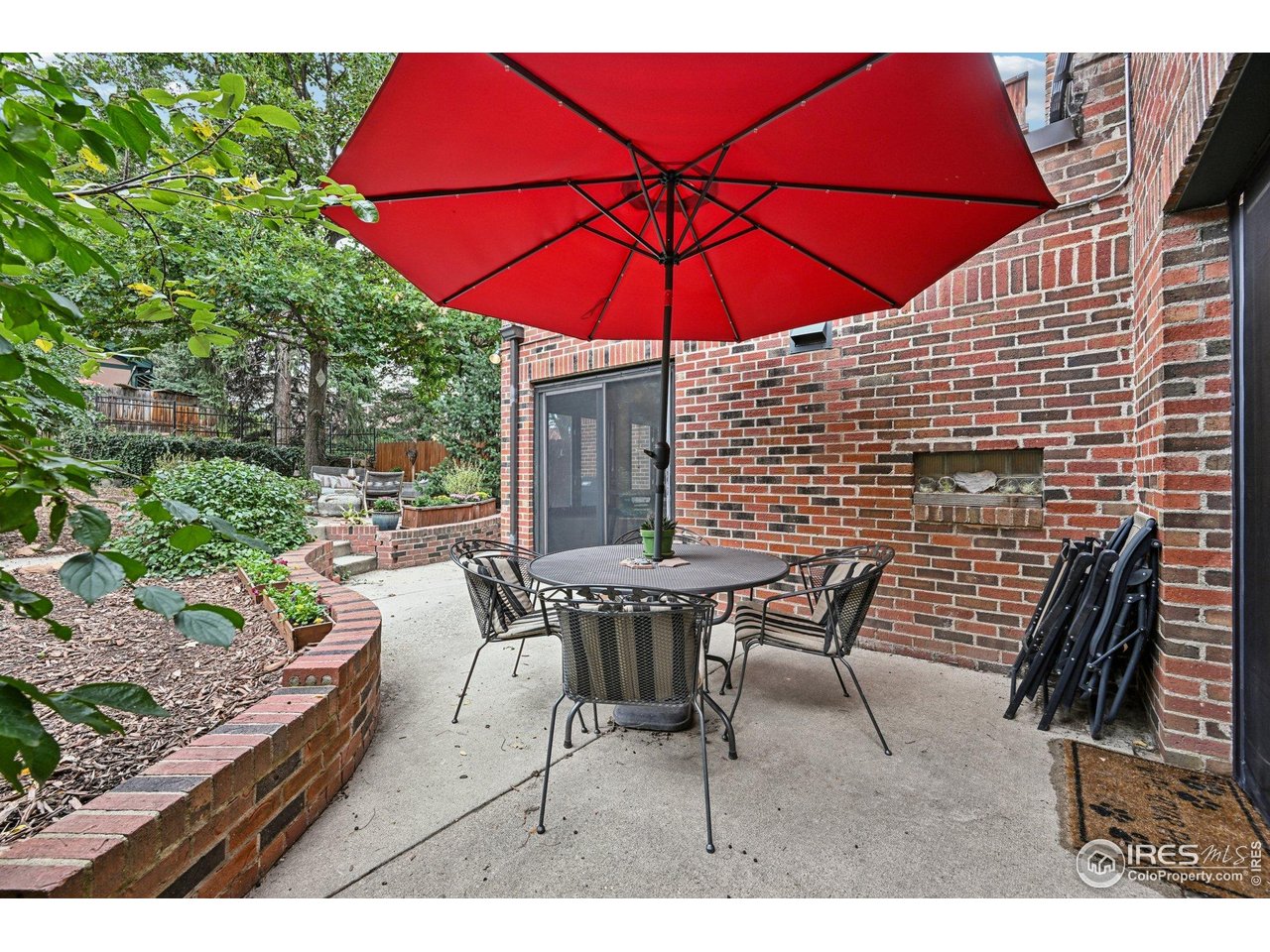 715 14th Street Boulder, CO 80302 - Photo 36 of 43 a patio with tables and chairs