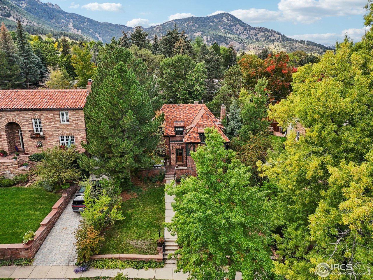 715 14th Street Boulder, CO 80302 - Photo 38 of 43 an aerial view of a house with a yard and mountain view in back