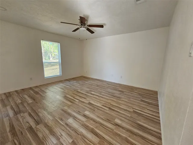 a view of empty room with windows