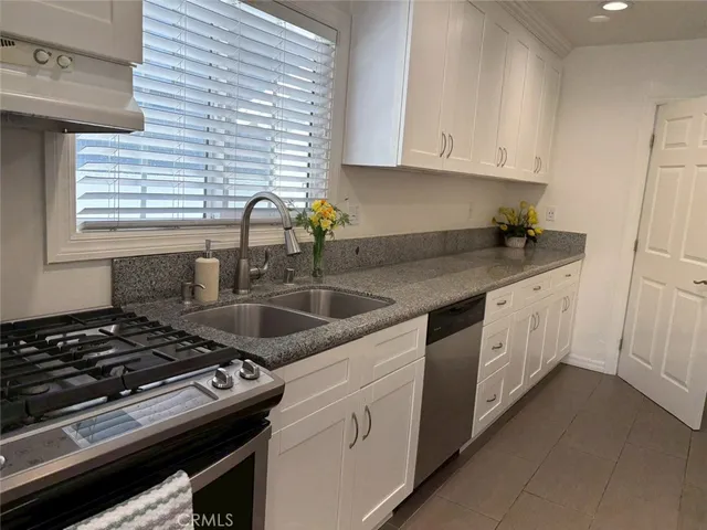 a view of entryway with wooden floor and stairs