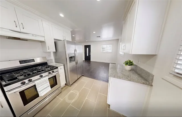 a view of entryway with wooden floor and door